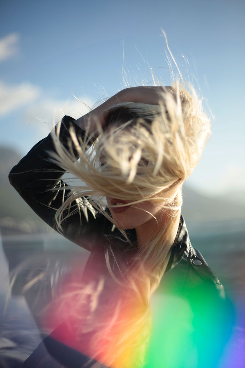 woman at outside in a windy day with blonde hair